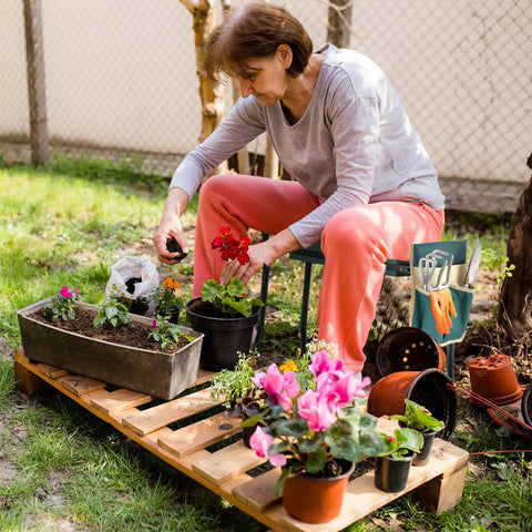 Woman gardening with Garden Kneeler Bench With Tools Pouch Foldable Garden Seat Stool Kneeling Pad Cushion For Patio Yard And Lawn