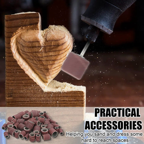Pro Grade 890 Piece Sanding Drum Set sanding carved wooden heart detail with electric tool in action.