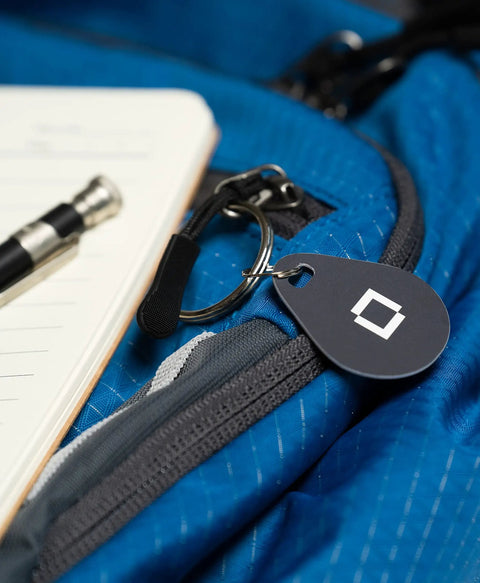 Key Fobs Four Pack NFC Enabled for Level Lock Plus Smart Locks Grey, Phone Free Access clipped on a blue backpack