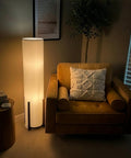 48 Inch Paper Lantern Floor Lamp With Wood Frame Asian Inspired Tower Shade in cozy living room corner with armchair