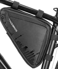 Close-up of On Frame Bike Triangle Bag with dual sided pockets, 1.5L capacity, mounted on a bike for tools and phone storage.