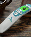 Medical Grade Non Contact Forehead Thermometer For Adults And Kids With Super Fast Accurate Readings Large Color LCD Screen And Ultra Easy One Button Use For Home Health Monitoring, shown on wood