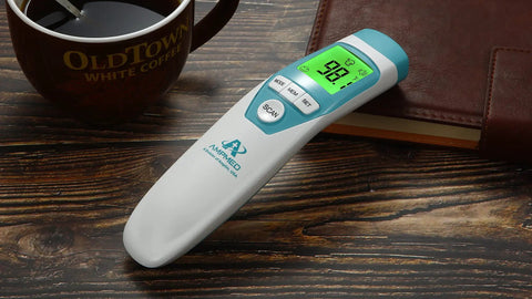 Medical Grade Non Contact Forehead Thermometer For Adults And Kids With Super Fast Accurate Readings Large Color LCD Screen And Ultra Easy One Button Use For Home Health Monitoring, shown on wood
