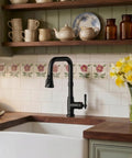 FORIOUS Vintage Kitchen Sink Faucet with Pull Down Sprayer, Matte Black installed in a farmhouse kitchen with wooden countertop.