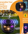 Compact magnetic Bluetooth speaker with colorful LED lights, shown in a garden setting with a smartphone app.