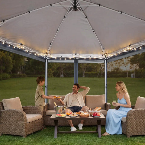 16x16 Pop Up Gazebo Hexagon Canopy Tent With Mosquito Netting, 256 Sq Ft Shade For Backyard, three people sitting under it