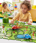 Toddler playing with 56 Piece Jigsaw Race Track Car Set For Toddlers And Kids Ages 2 3 4 5 6 Colorful City Theme Puzzle Tracks With Cars And Traffic Signs A Fun Gift For Boys That Builds Fine Motor Skills IQ And Imagination