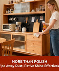 Woman using Top Shelf 2 In 1 Wood Cleaner And Furniture Polish Featuring Pure Orange Oil Spray on kitchen dresser.