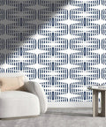 Slick Textured Vinyl Wallpaper Roll In Warm Light Hues For Fast Wall Refreshes And Chill Room Vibes on patterned wall behind modern furniture.