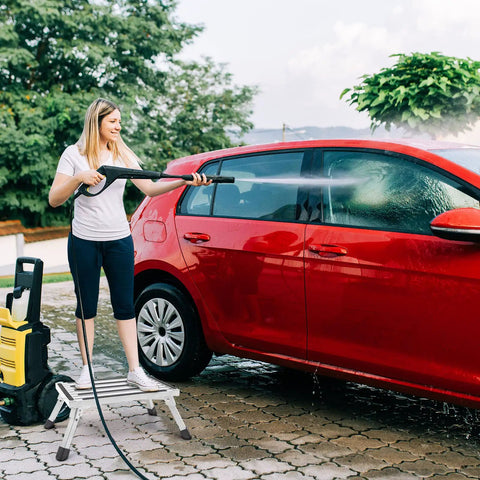 Woman washing car using Heavy Duty Aluminum Working Platform Step Stool Ladder for RV Camper SUV Up To 500lbs with Non Slip Surface and Rubber Feet Foldable Portable Work Platform with Stable Steps.