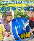 Kids playing with 15 Ft race track compatible with 1/64 cars, showing dual blue lanes, loops, and yellow blocks outdoors.