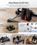 AtomStack Swift Mini laser engraver with aluminum rails, red laser module; desktop, 135×145mm work area, AI software.
