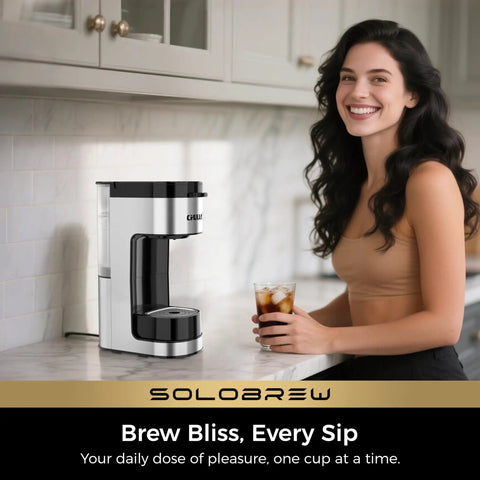 Woman holding iced coffee next to Single Serve Coffee Maker For K Cup And Ground Coffee, 3 Brew Sizes With Strong Brew And Over Ice, 14 Oz Removable Water Reservoir, Ideal For Home, Office, Travel, RV Or Dorm Use on kitchen counter