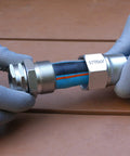 Hands using Heavy Duty 3/4 Inch Garden Hose Repair Kit With Stainless Steel Male And Female Ends, Lead Free Barb Water Hose Connectors