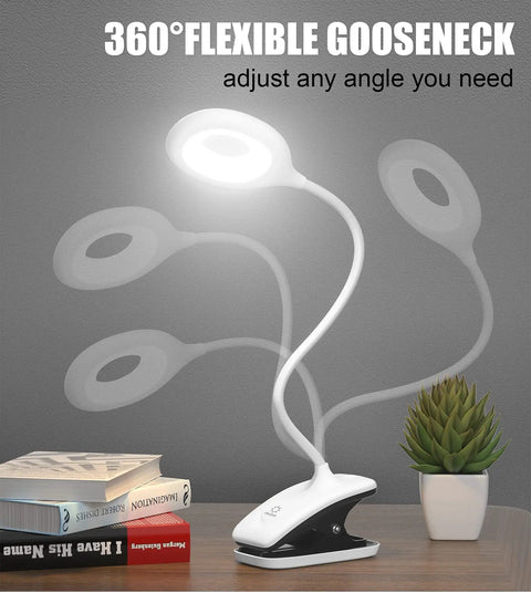 Clip On LED Desk Lamp With Battery Power Cordless Bedside Light showing flexible arm on desk next to plant and books