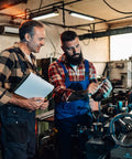 Two men discussing machinery next to an Aluminum Lathe Hand Wheel 50mm OD 5mm Bore With Rotating Handle for Milling Machines.