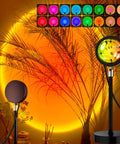 Sunrise Mood Lamp With Remote, 16 Color Changing Sunset Projector for Bedroom casting warm glow on plants