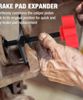 Using Brake Pad Spreader And Caliper Tool For Cars And Light Trucks With 360 Degree Swivel Joint Piston Compressor in close-up.
