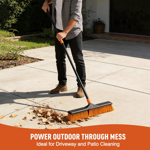 Solid 24 Inch Heavy Duty Push Broom Built Different To Handle The Daily Grind Sweeps Garages Decks Patios Yards Workshops And Concrete Floors Fast With Zero Hassle, cleaning leaves on a patio.