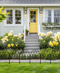 Front view of house with Garden Fence Set With No Dig Ground Stakes Arched Metal Panels For Dog Barrier And Flower Bed Edging