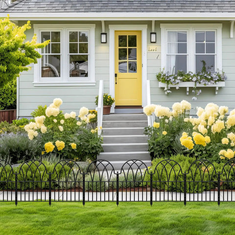 Front view of house with Garden Fence Set With No Dig Ground Stakes Arched Metal Panels For Dog Barrier And Flower Bed Edging