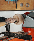 Heavy Duty Woodturning Hollowing Tool With Replaceable Carbide Tipped Round Blade And Solid Beech Handle used for shaping a wooden bowl.