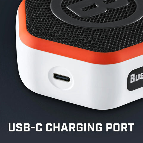 Close-up of USB-C charging port on Wingman Mini GPS Speaker With Audible Distances, Ultra Portable Bluetooth Golf Speaker On The Go, Waterproof IPX7, 10 Hour Battery, Magnetic Cart Mount, Built In Microphone For Calls, Carabiner Clip, Orange.