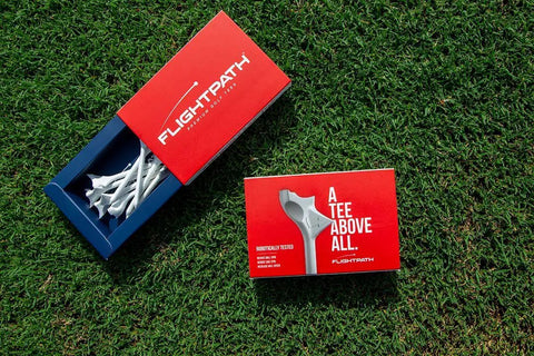 Diamond Golf Tees That Cut Spin For Longer, Straighter Drives And Zero Friction Feel, 3.25 Inch Tees in red packaging on grass
