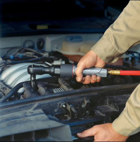 1077XPA Half Inch Air Ratchet Wrench With 360 Degree Exhaust in use for automotive maintenance