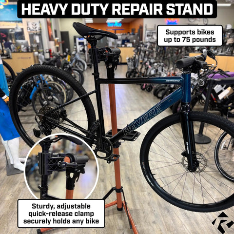 Beefed Up Heavy Duty Bike Repair Stand With Storage Bag Adjustable Height Up To 30 Inches 360 Degree Rotating Clamp Magnetic Tool Tray Telescoping Center Pole Perfect For Road Mountain Hybrid Or Commuter Bikes holding a bicycle in a shop