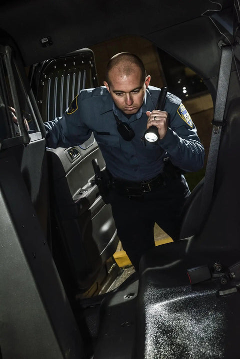 Security officer using UltraStinger 1100 Lumen Tactical Duty Flashlight With 65000 Candela Rechargeable Long Range Beam