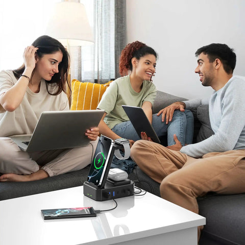 All In One 300W Charging Station for Multiple Devices With 10 in 1 Wireless Charger GaN III USB C 65W PD on table with laptops