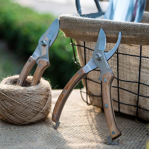 Workhorse Wood Handle Pruning Shears With SK-5 Blade beside twine, showcasing 8 inch length, 1 inch cutting capacity, in garden setting