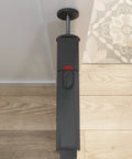 Close-up of pressure-mounted mechanism of Walk Through Metal Baby Gate For Doorways, Adjustable From 29.5 To 40.5 Inches, Gray.