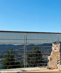 Pet Balcony Net For Cats And Dogs 16.5 Ft By 2.5 Ft Anti Fall Mesh Screen Black installed on outdoor balcony with cat