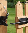 Tough As Nails Heavy Duty Gate Latch With Cable Pull For Wooden Fence, black steel latch with cable on a wooden gate.