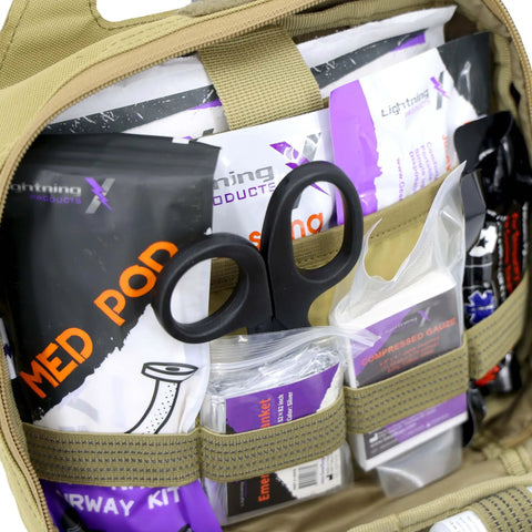 Interior of Rip Away Officer's Patrol Tactical Gunshot And Trauma IFAK Kit With Headrest Mount Desert Tan with medical supplies