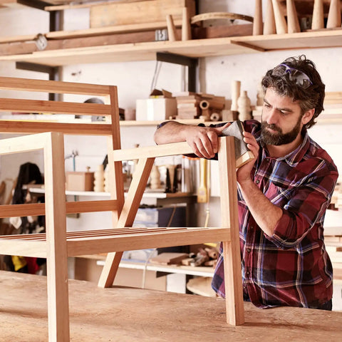 Craftsman adjusting wooden chair frame in workshop using Tough As Nails M12 T Nuts, 12 Pc Zinc Plated Steel Four Prong Blinds.
