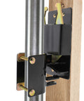 Close-up of black two way farm gate latch for livestock and horses, black weatherproof gate catch for cattle corrals and ranches.