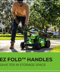 Man using 40V 20 Inch Brushless Cordless Lawn Mower With 4Ah Battery And Charger, foldable handles showing compact design
