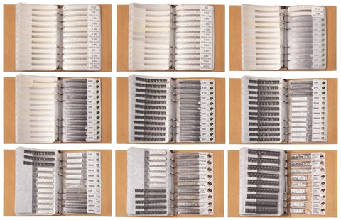 Open books showing organized Two Book SMT Components Kit With 9100 Pieces Including 0805 Resistors And Capacitors Transistors Diodes MOSFETs.