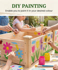 Children painting 8x2ft Outdoor Wooden Raised Garden Bed With Elevated Planter Box for Veggies and Herbs with colorful flowers.