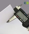 Measuring the thickness of a Food Grade Silicone Rubber Sheet 6 By 6 Inch One Eighth Inch Thick White 3 Pack with caliper