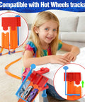 Child playing with a Two Lane Starting Gate For Toy Car Tracks Lets You Launch Two Cars At Once Quick Plug And Play Install In Seconds