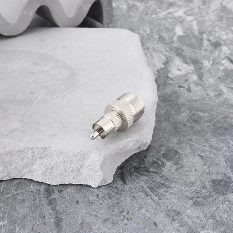 UHF SO239 Female To RCA Male Coax Connector Adapter on a stone surface for Ham Radios and Heathkit Gear
