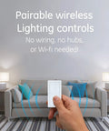 Hand holding remote in living room for Dimmable Wireless Plug In Light Switch With Remote 1 Outlet 150 Ft Range No Wiring Needed