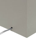 Close-up of the gray leather-wrapped rectangular base of the Leather Wrapped Modern Table Lamp With White Fabric Shade In Gray.