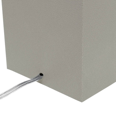 Close-up of the gray leather-wrapped rectangular base of the Leather Wrapped Modern Table Lamp With White Fabric Shade In Gray.
