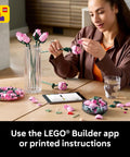 Botanicals Pink Rose Bouquet Buildable Flowers Set For Adults 18 Plus Gift For Her Home Office Decor Shelf Or Room Display Cool DIY Flower Arrangement 10374, woman assembling pink LEGO roses