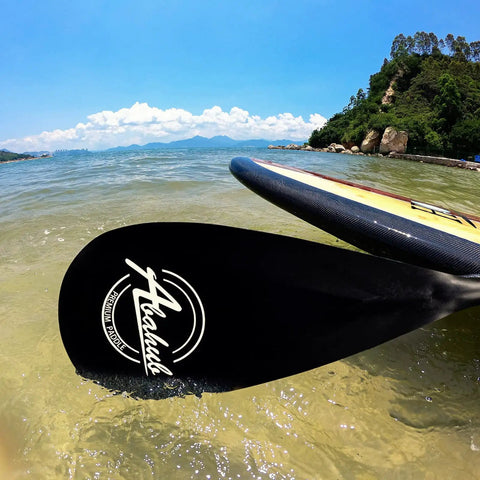 Legit Three Piece Adjustable Stand Up Paddle Board Gear With Durable Composite Blade And Secure Carry Pouch on water.